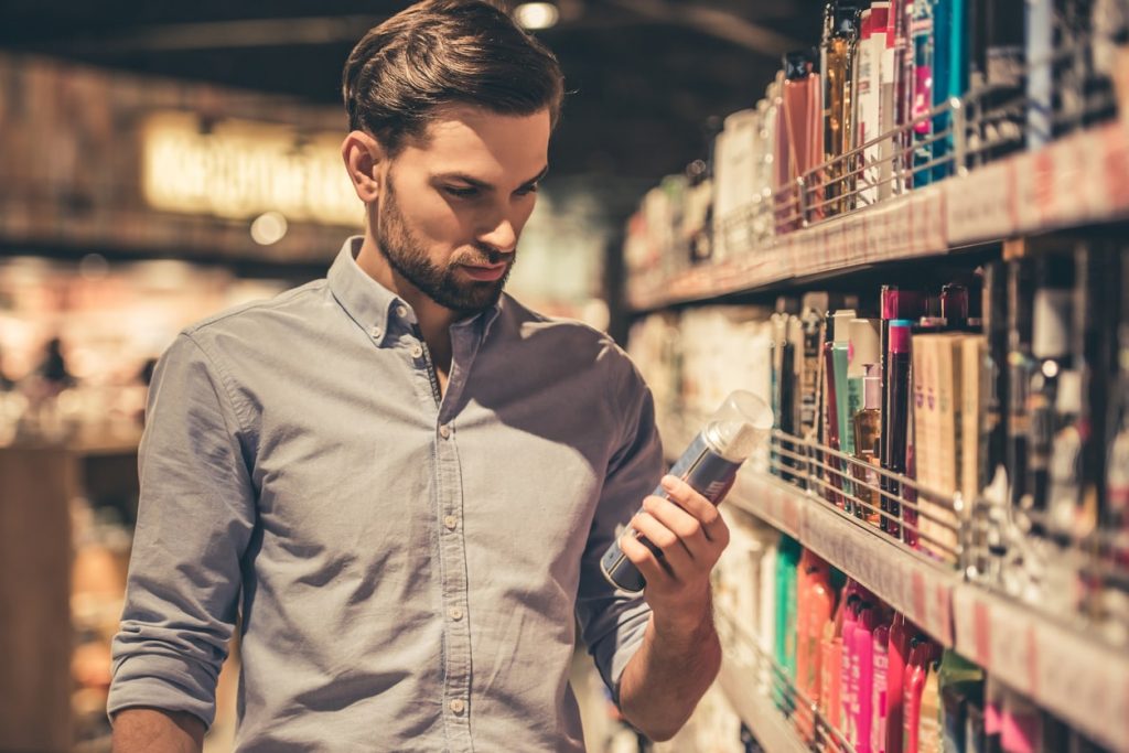 a man trying to buy shampoo on a supermarket. The Paradox of Choice