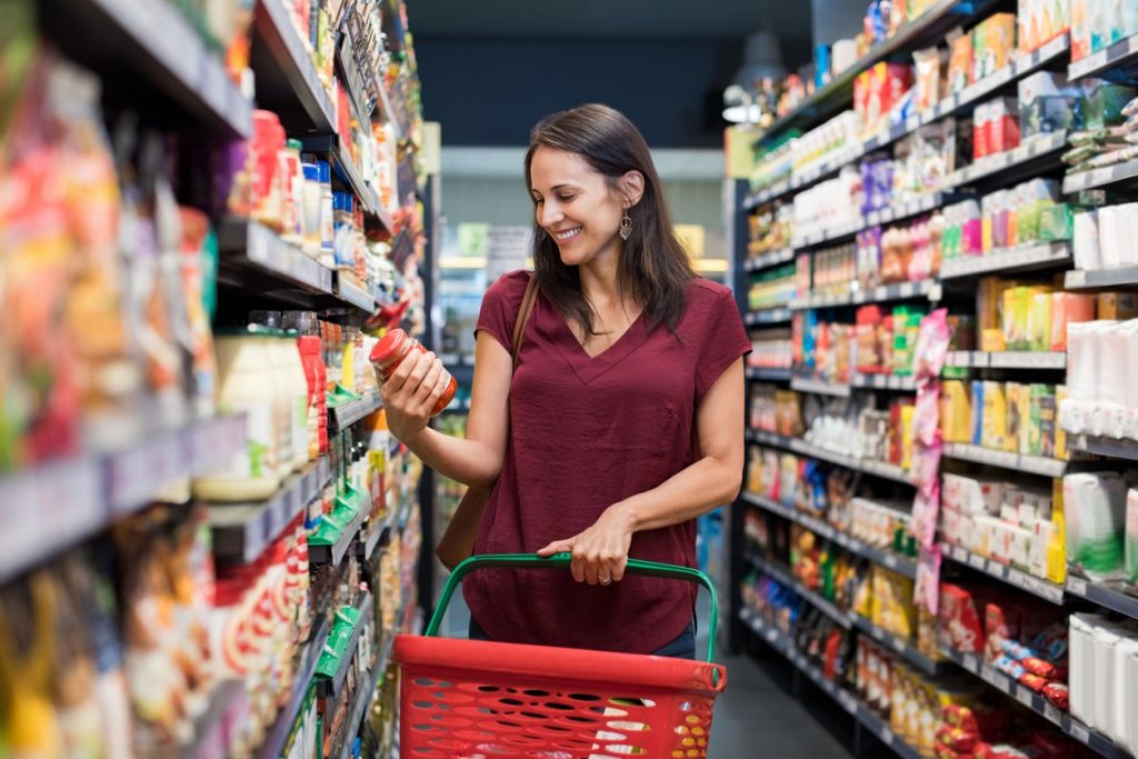 consumer making a decision on a supermarket