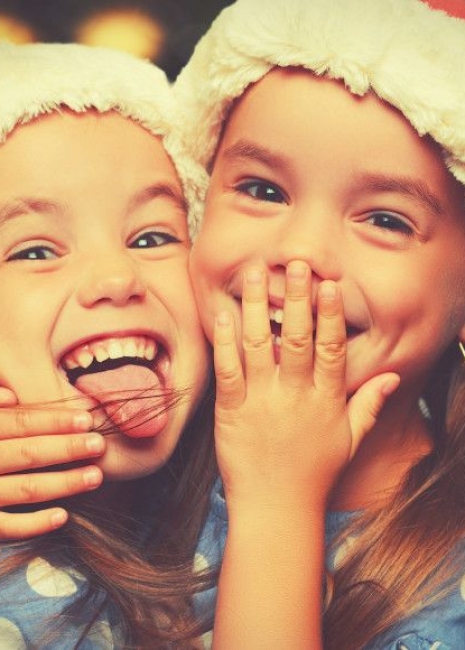 Christmas Happy funny children twins sisters hugging